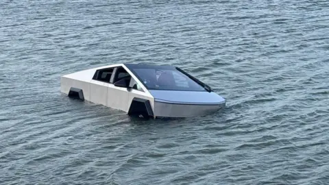Tesla Cybertruck partially submerged in Grapevine Lake during Wade Mode test in Texas