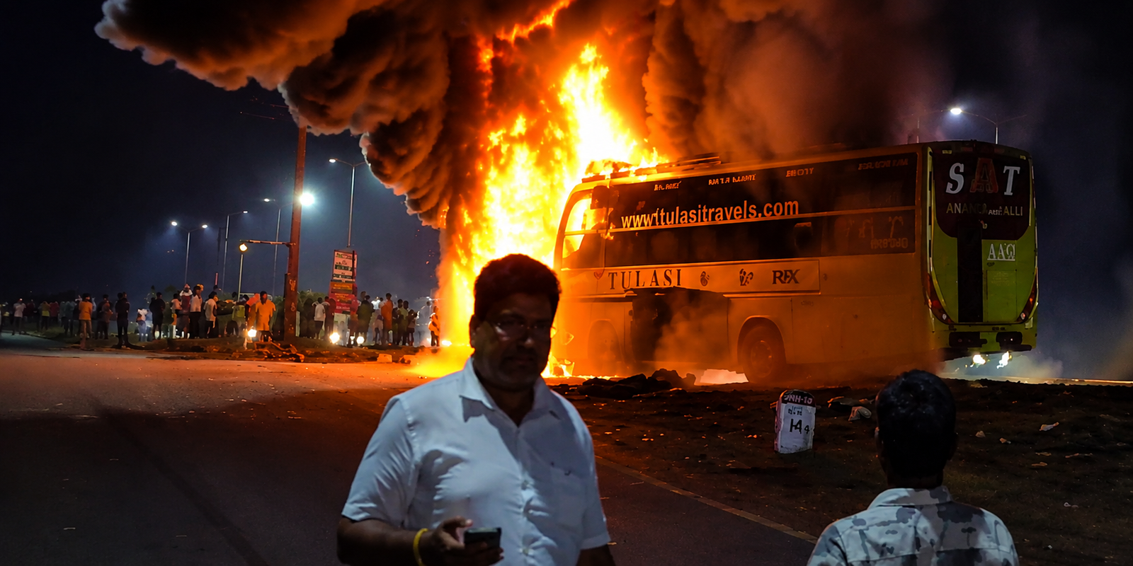 Burnt luxury bus after fire near Anakapalli.