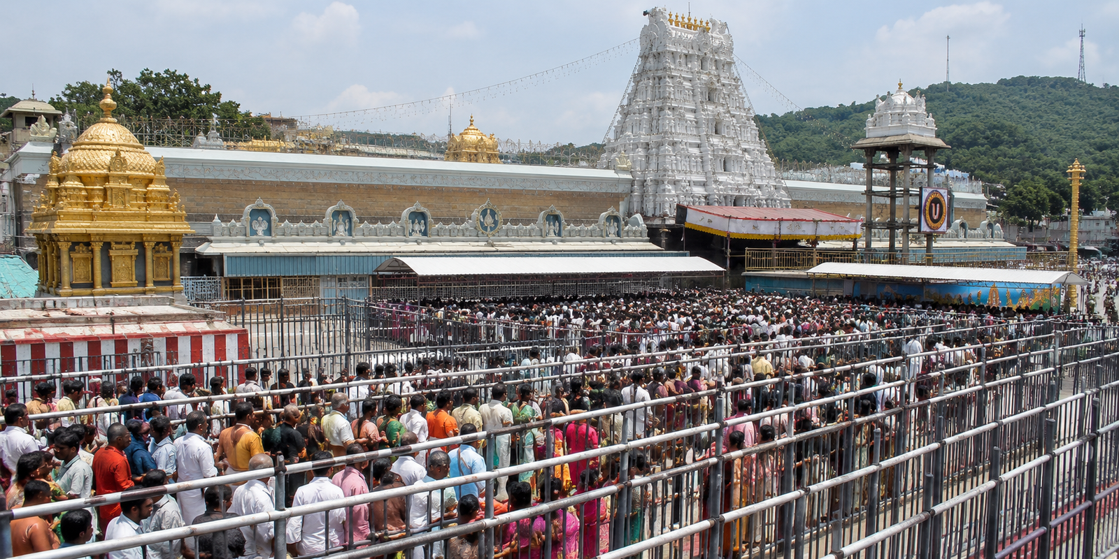 Devotees waiting in long queue at Tirumala temple.