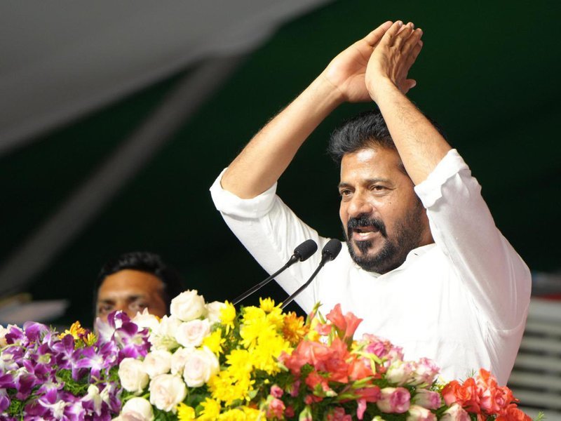 Revanth Reddy addressing people during his political journey.