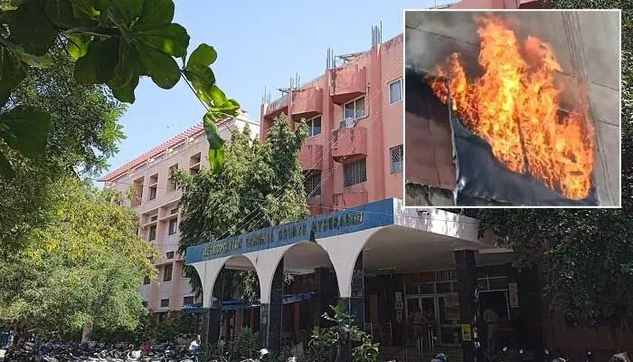 Firefighters controlling minor fire at Nampally Criminal Court building.