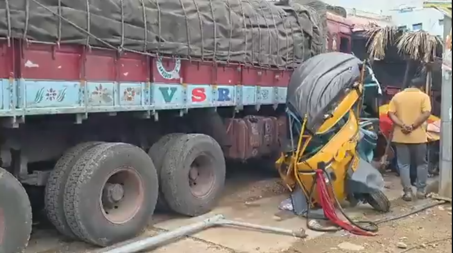 Damaged auto after lorry collision near Kambam.