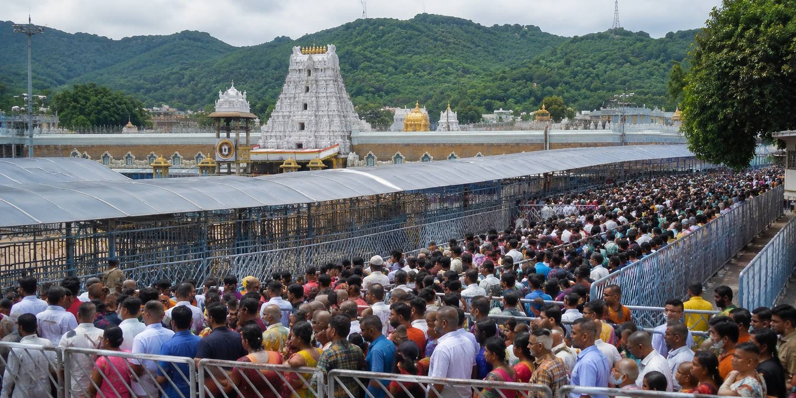 Devotees waiting in long queues at Tirumala temple.
