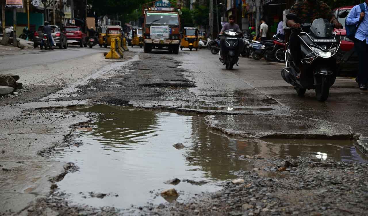 Waterlogged potholes on Hyderabad roads after monsoon rains