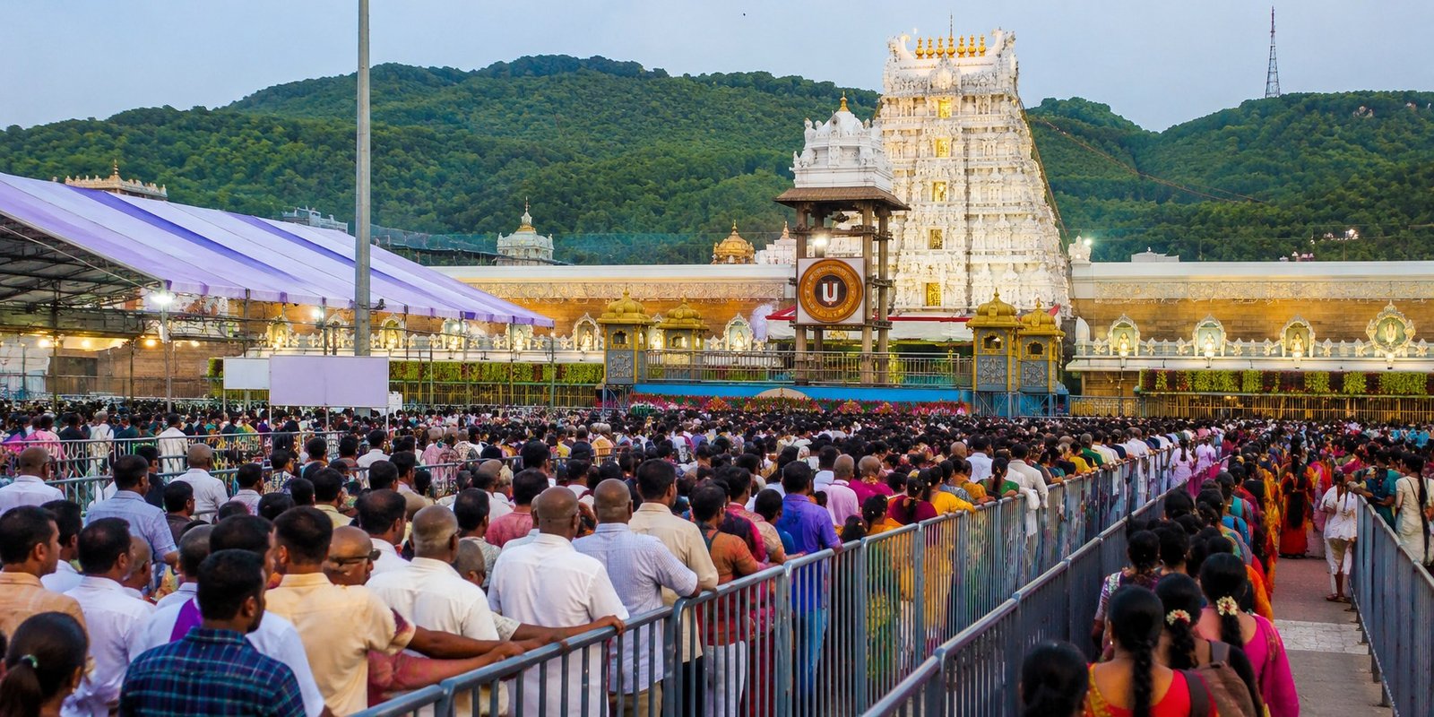 Devotees waiting in long queue at Tirumala temple.