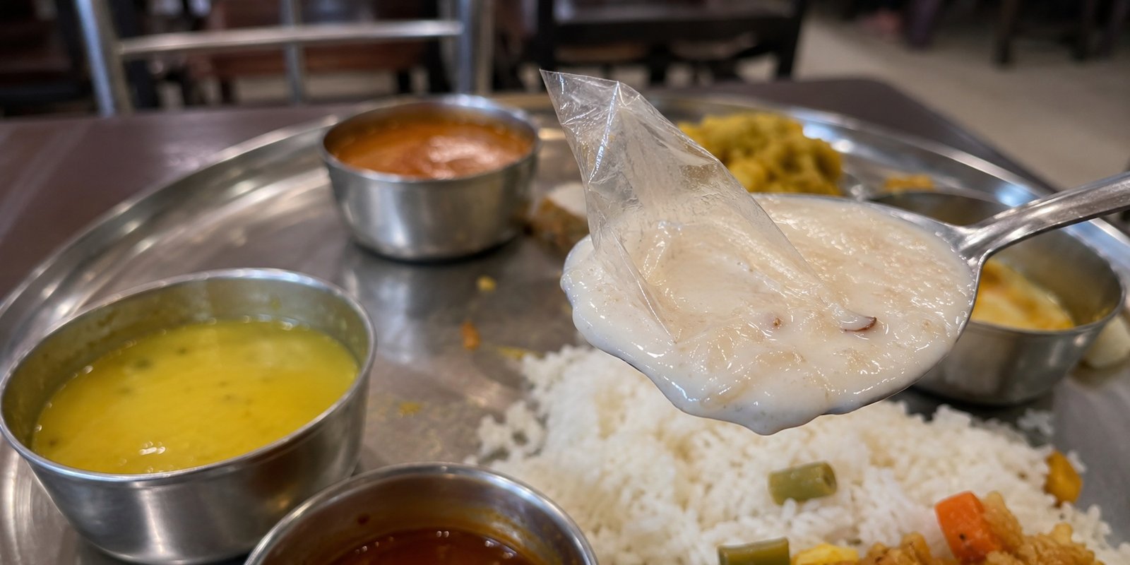 Plastic cover found in meals served at Fuel Box Restaurant.