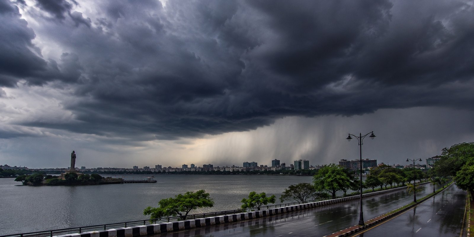 Dark monsoon clouds over Hyderabad as rain approaches.
