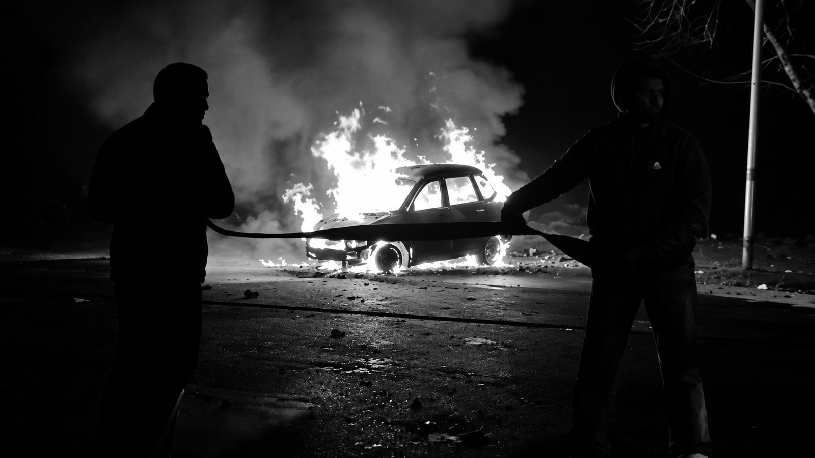 Burnt car after collision with lorry near Bodegudem National Highway