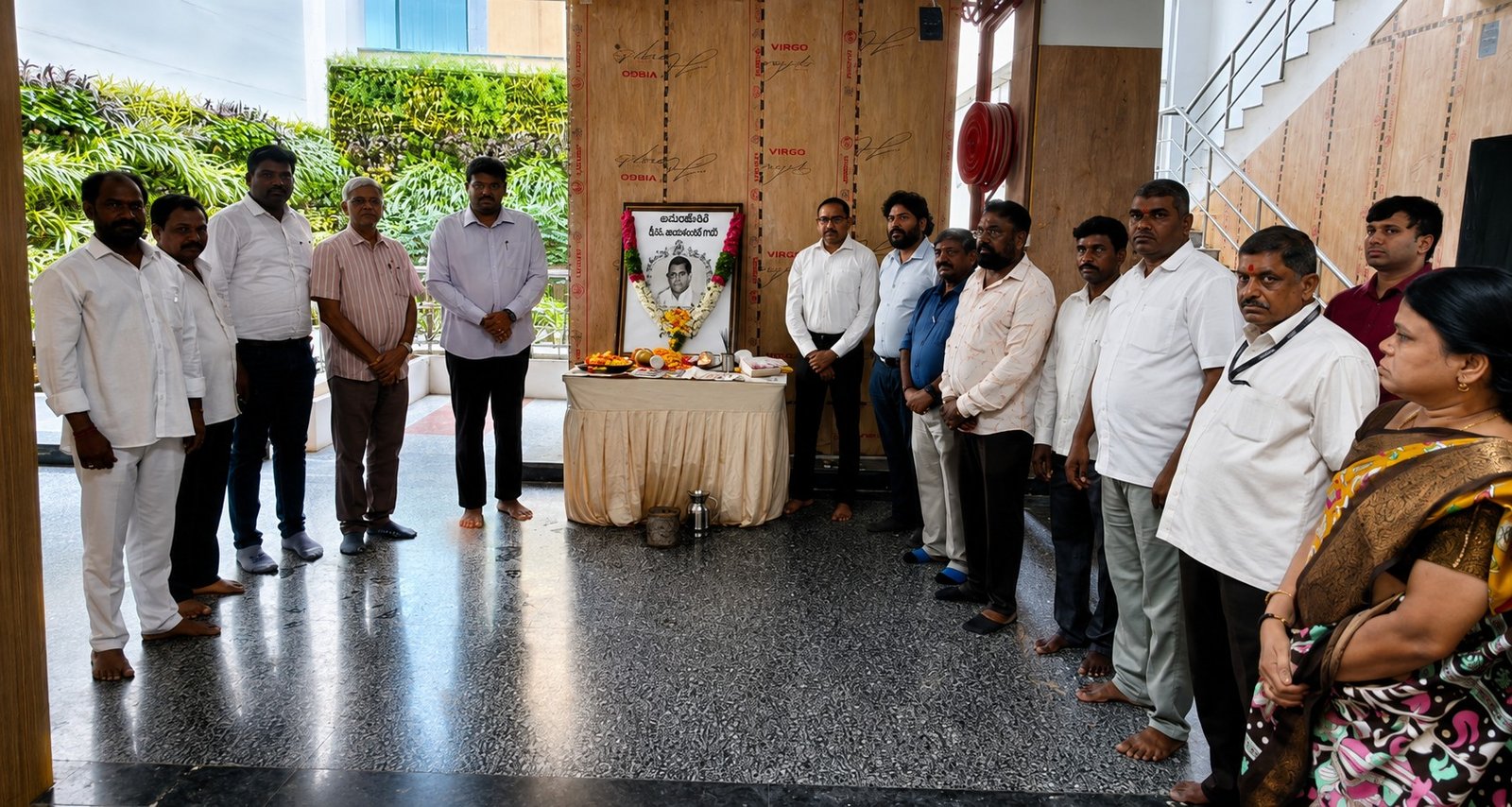 Officials paying floral tribute to Acharya Jayashankar at Serilingampally Zonal Office.