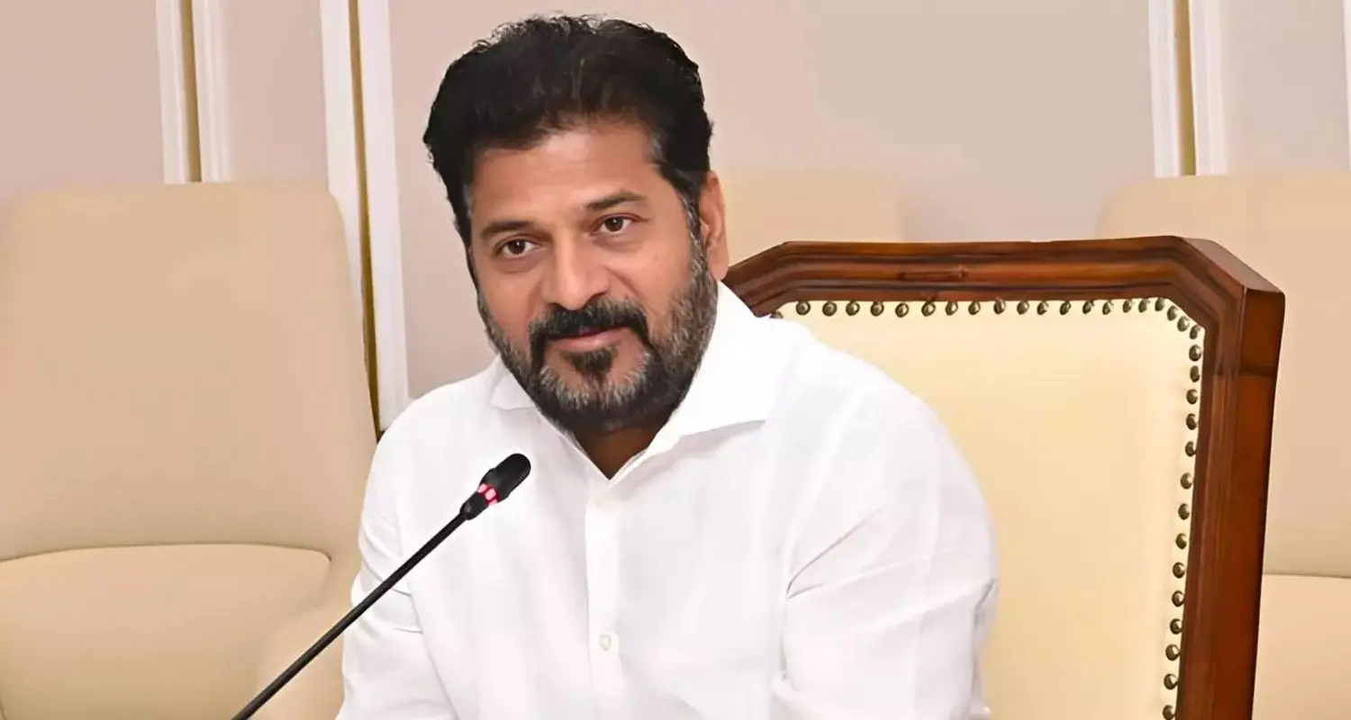 Revanth Reddy reviewing the 22A land issue with officials