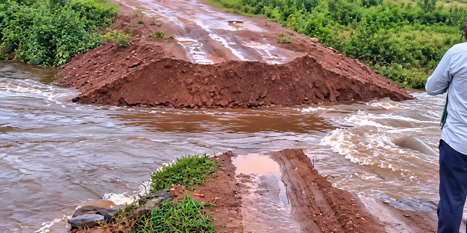 Heavy rains wash away temporary bridge near Chinna Gangavaram