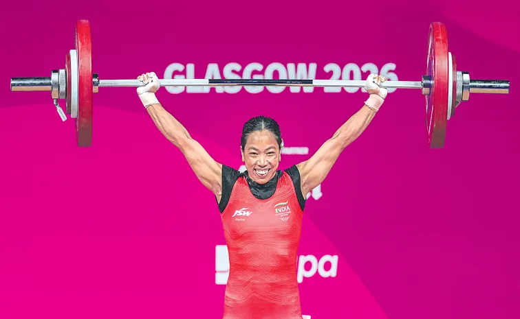 Mirabai Chanu celebrates after winning silver at Asian Games 2026.