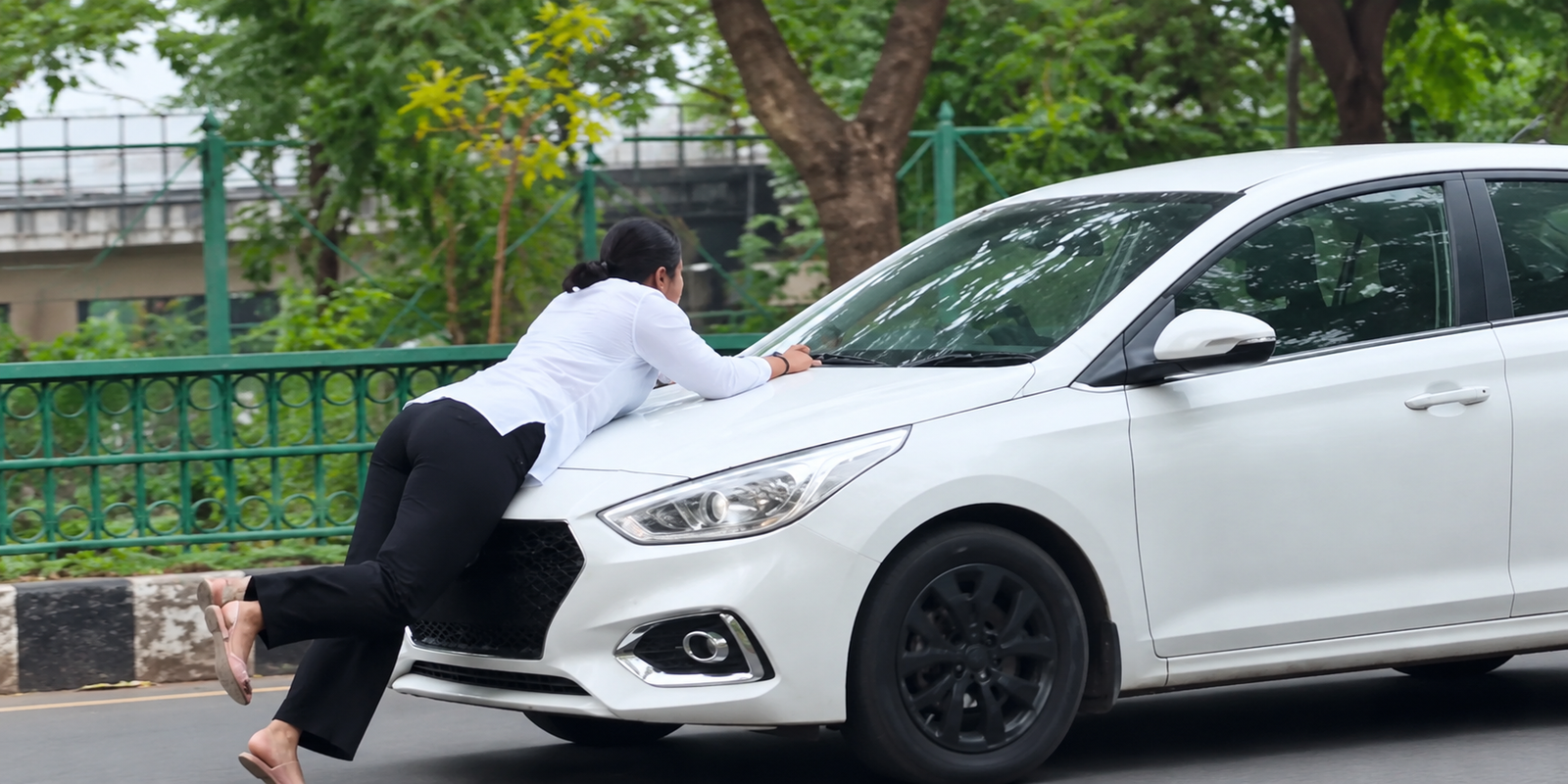 Woman lying on car hood during Lucknow viral incident