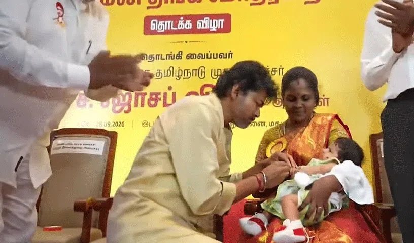 CM Vijay presents gold rings to newborn babies in Madurai.