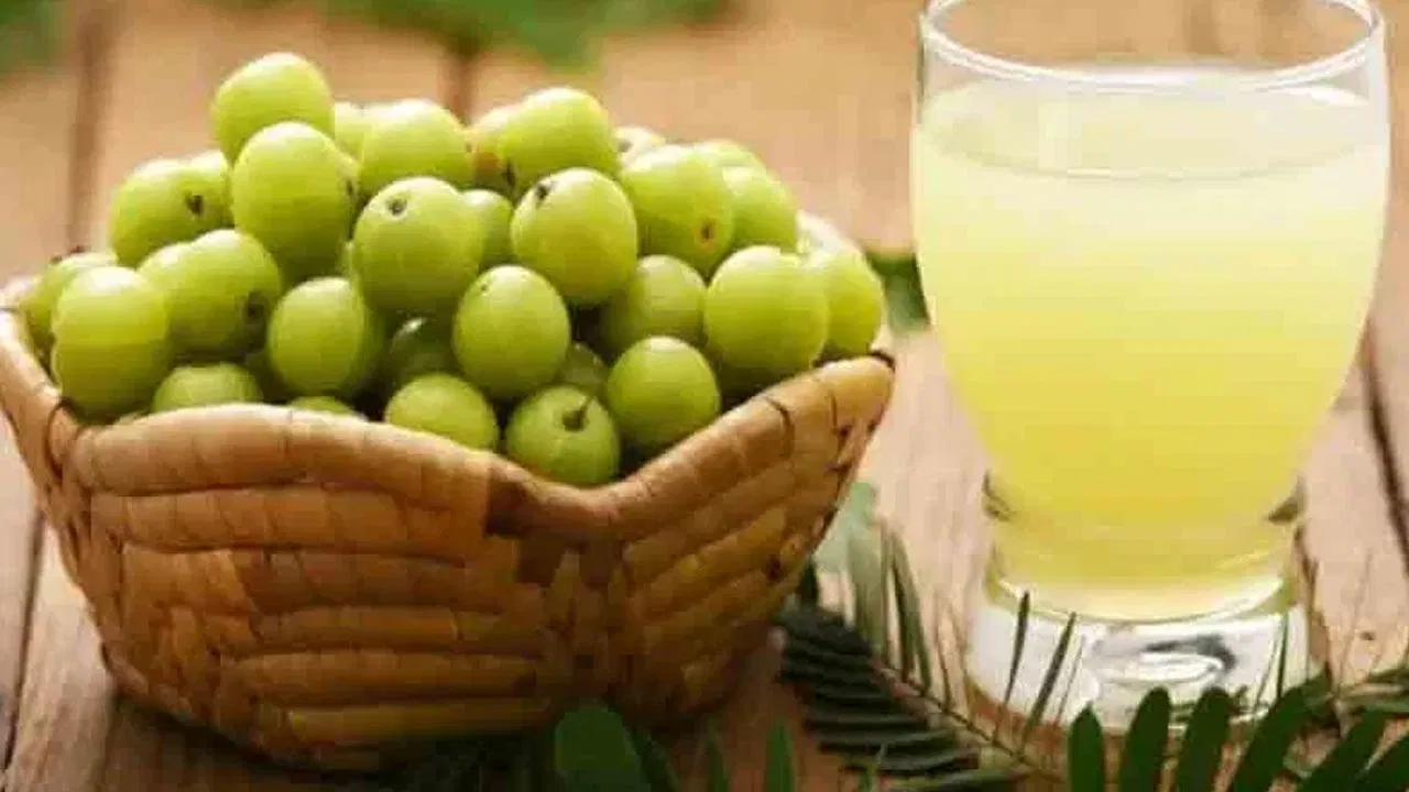 Fresh amla fruits showing their natural green color and texture.