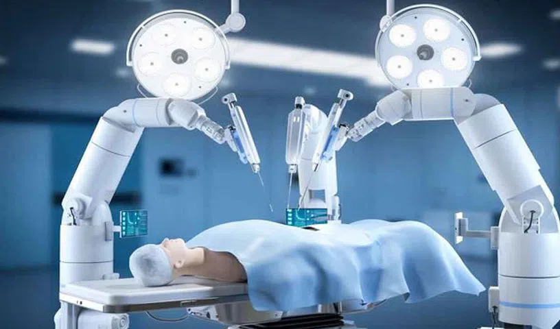 Doctor controlling a robotic surgery system during a medical procedure.
