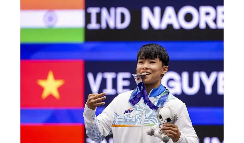 Roshibina Devi celebrates after winning silver medal in Wushu