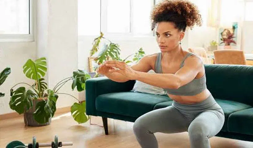 Person performing squats with proper knee alignment