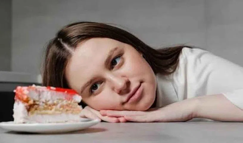 Person craving sweet foods and unhealthy snacks