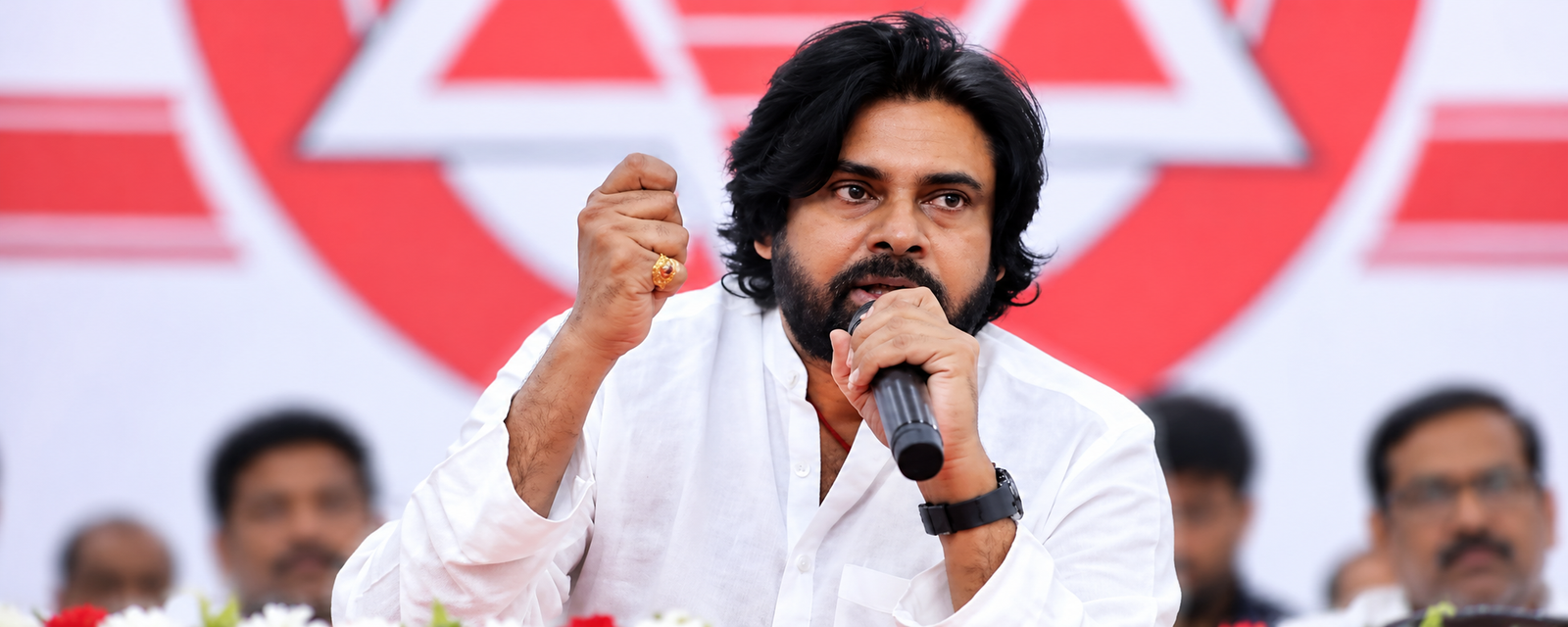 Pawan Kalyan addresses Jana Sena leaders at a village meeting.