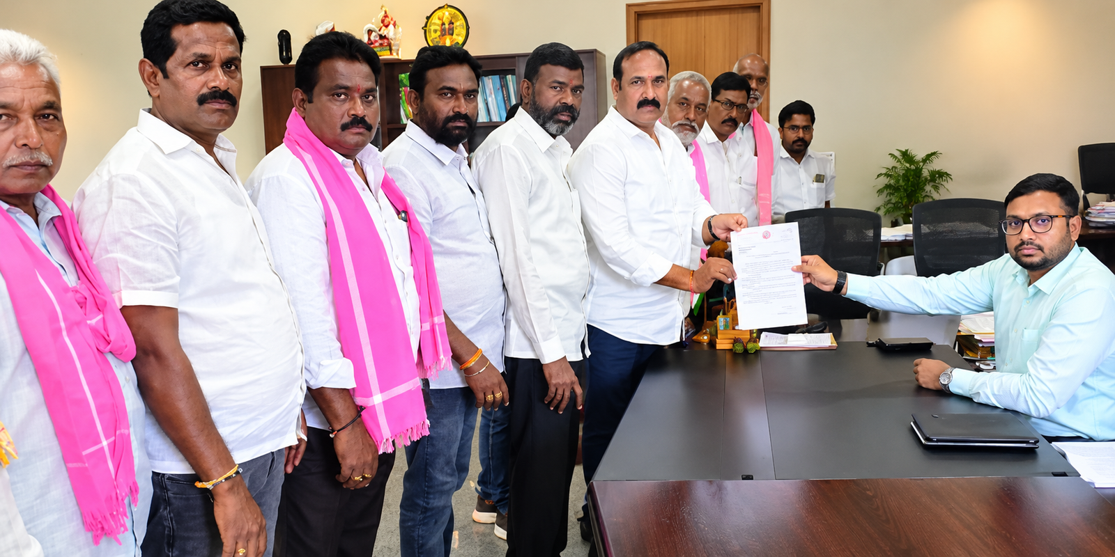 Bollam Mallaiah Yadav submitting a drought relief petition to the district collector.