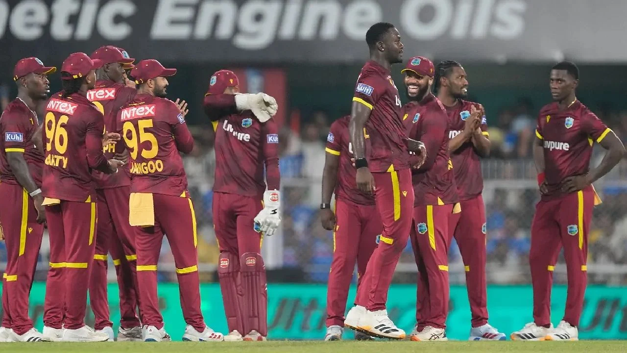 West Indies players celebrate their T20 cricket sixes record.