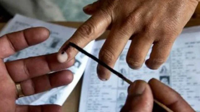 AP municipal election officials distributing polling materials ahead of voting.