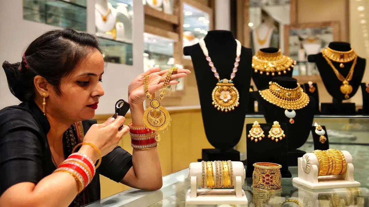 Gold jewellery and silver bars displayed at a precious metals store.
