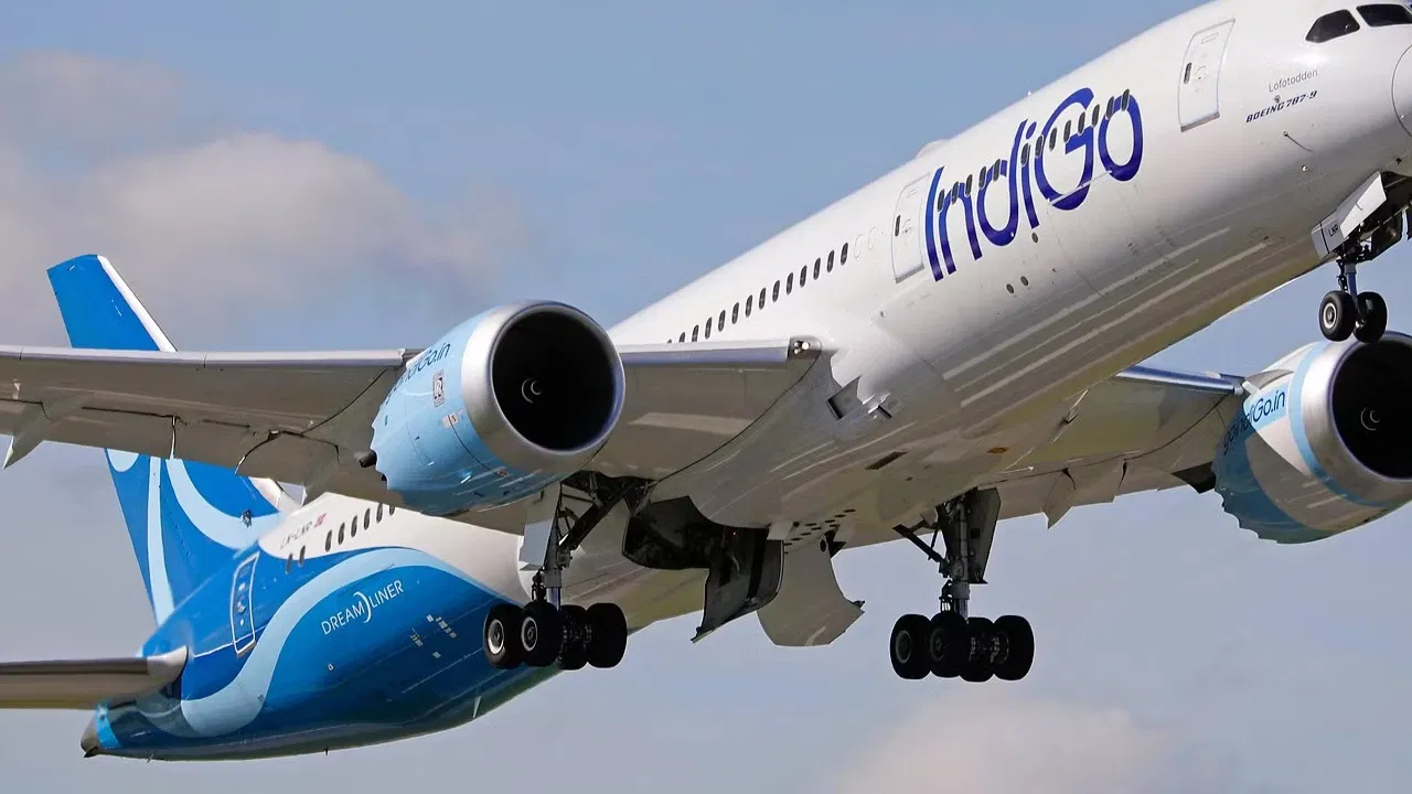 IndiGo passenger aircraft at airport amid rising flight ticket prices.