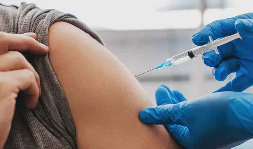 Older adults and children receiving seasonal flu vaccination before winter.
