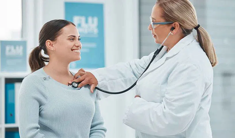 Middle-aged woman learning about menopause symptoms and women’s health.